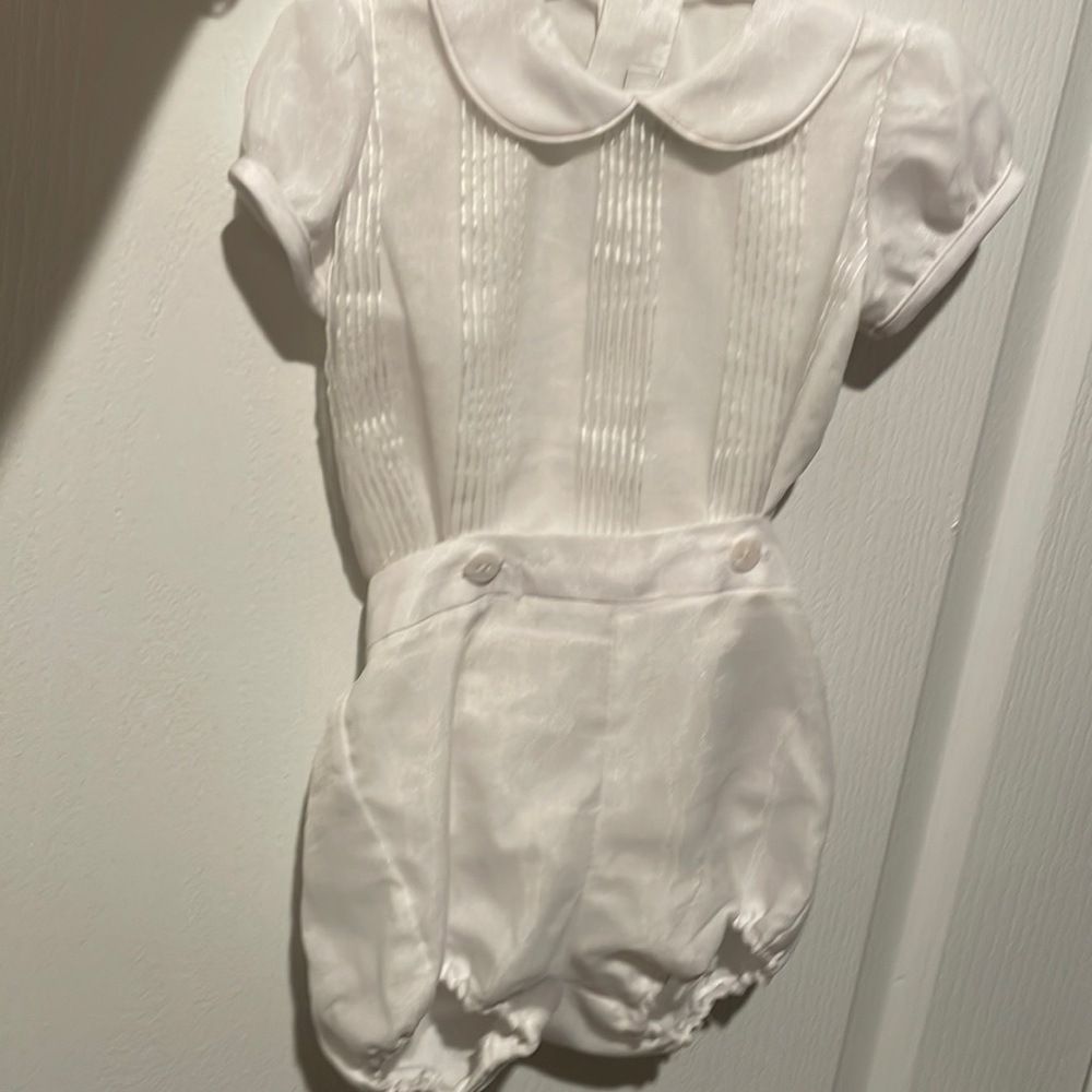 white baptism shirt and shorts with white shoes